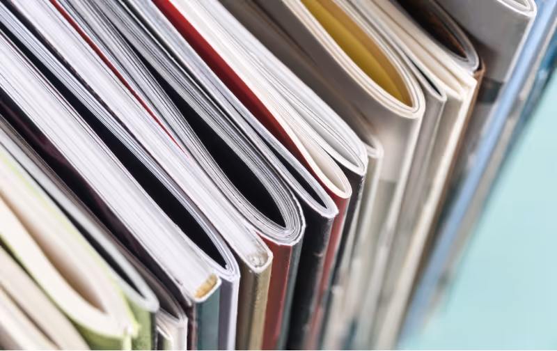 shelf of various booklets and magazines