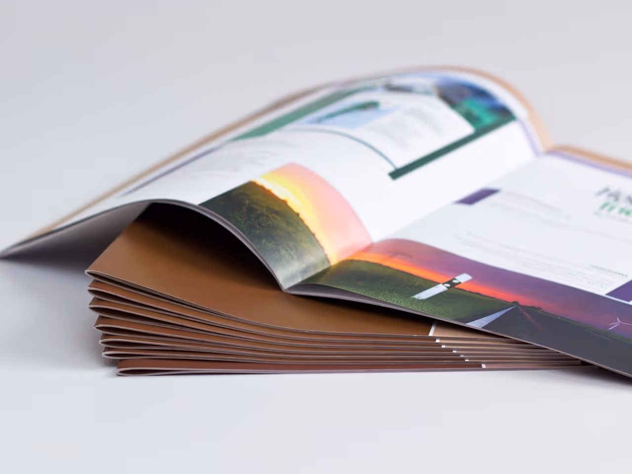an open booklet on a stack of booklets