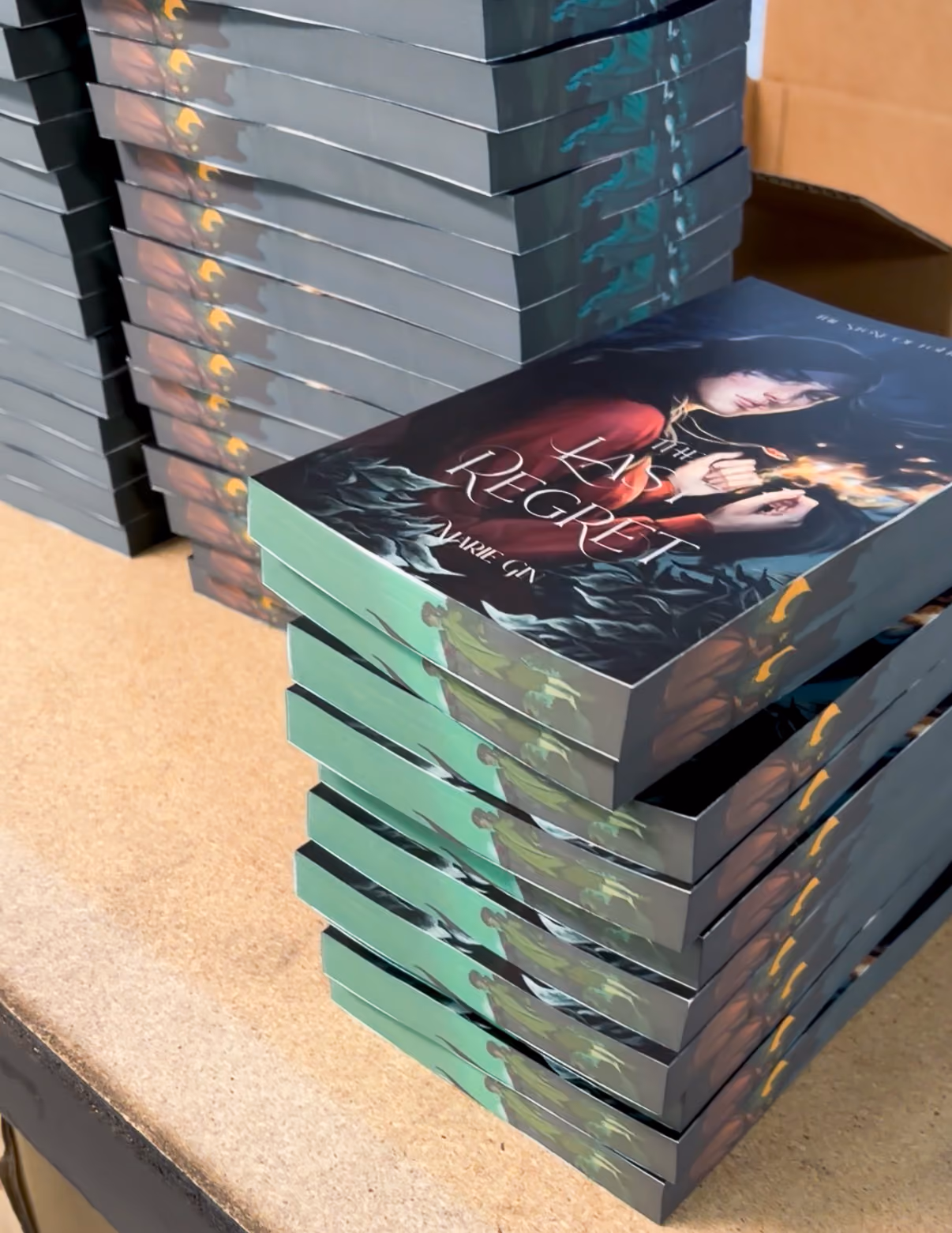 stack of books by Marie Gin with sprayed edges, printed by FolioFox