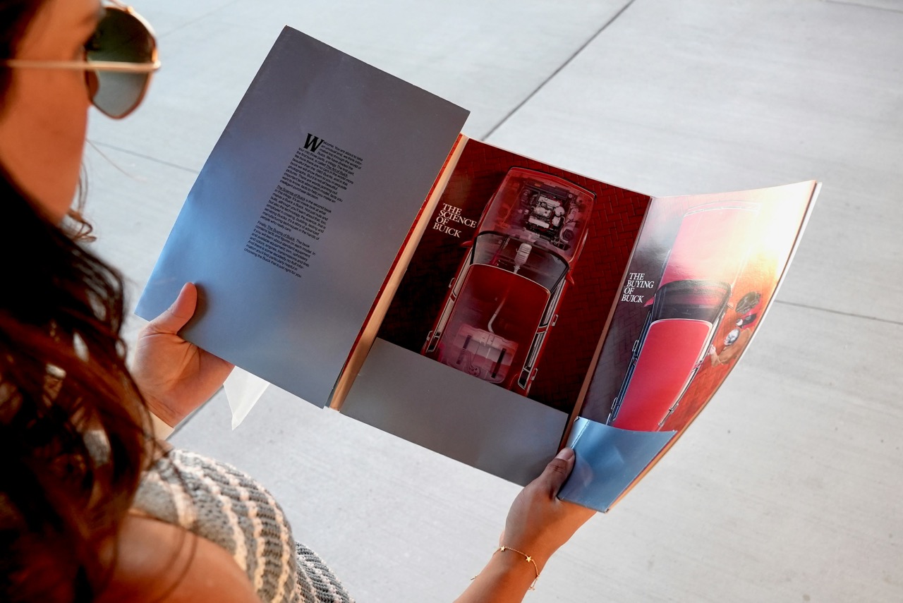 woman holding print brochure booklet - Photo by Coalesce Digital on Unsplash