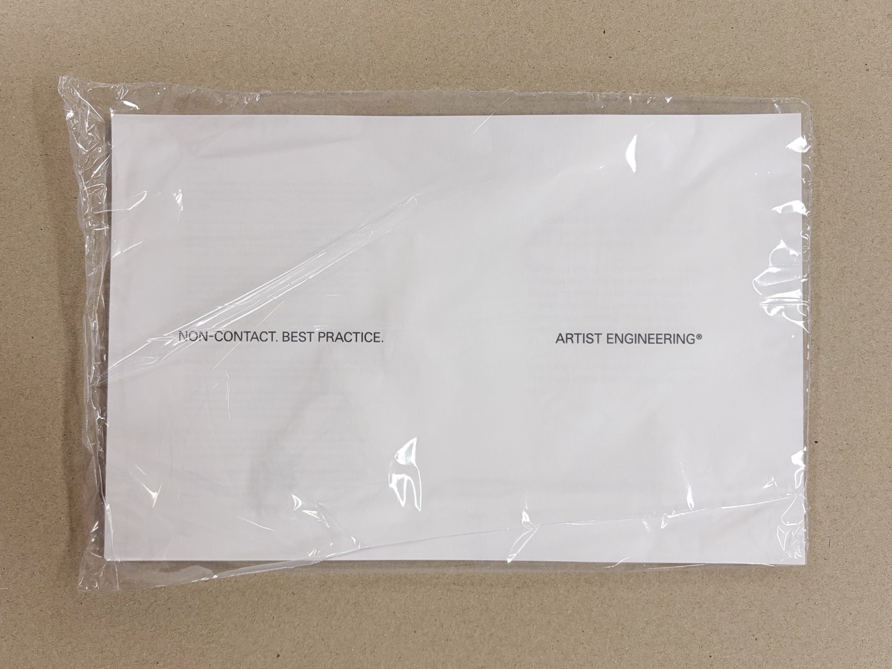 Example of an unbound proof for a saddle-sttich booklet, shrink-wrapped for protection.