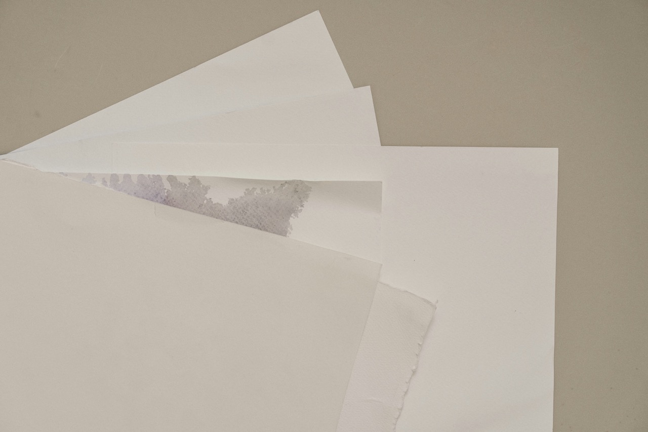 Stacked pieces of paper. Image by Kurt z on Unsplash
