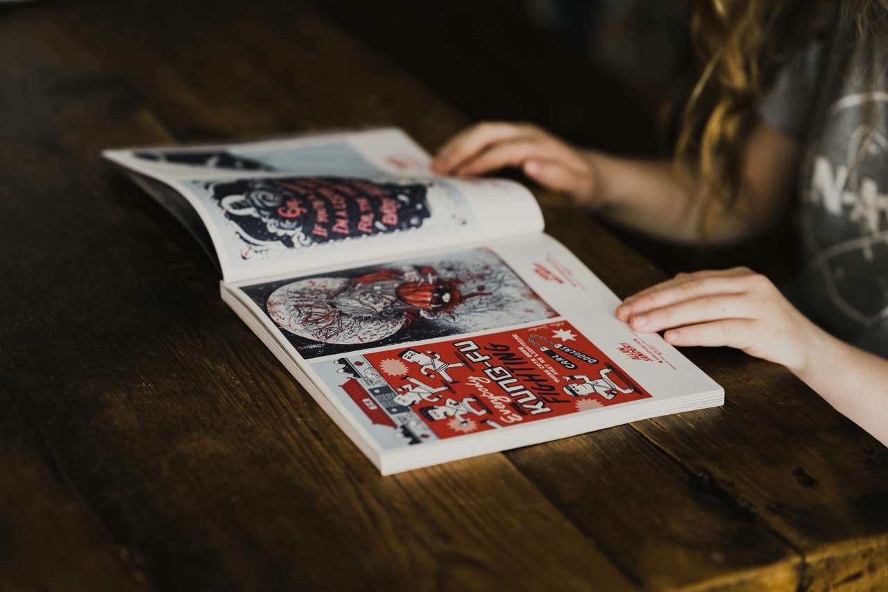 Woman browsing a magazine, image by Annie Spratt from Unsplash