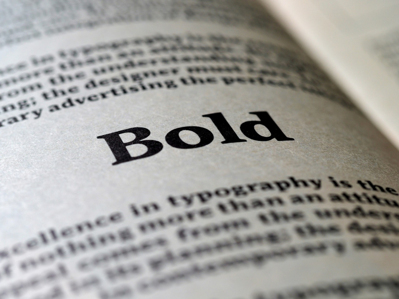Close up of the world Bold in bold, on an open printed book. Image by Brett Jordan from Unsplash.