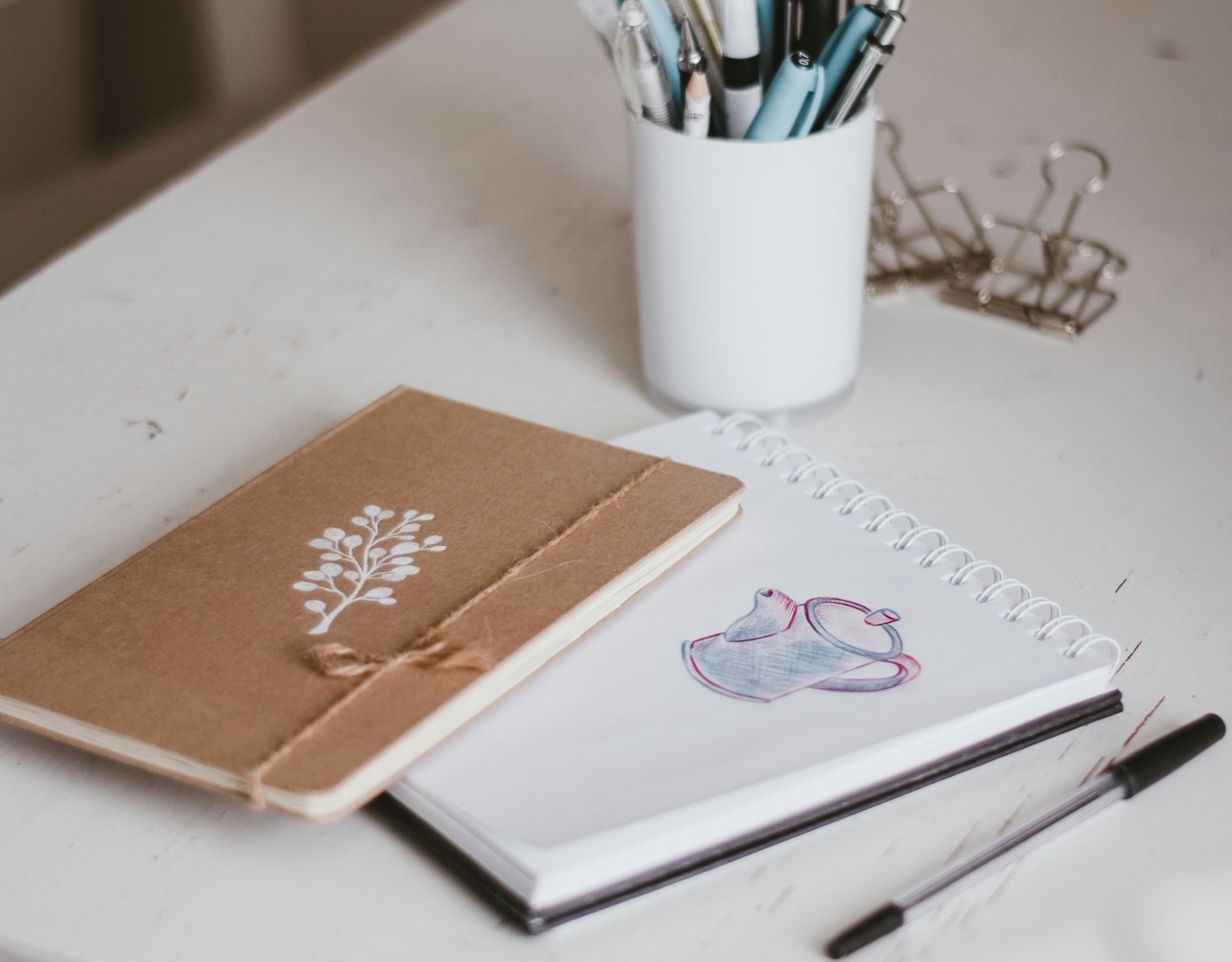 small notebooks on a table. Photo by pure julia on Unsplash