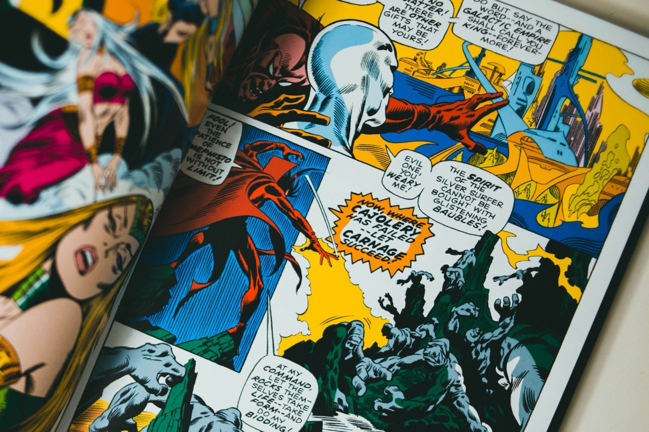 Photo of an open comic book. Image by Jonathan Cooper on Unsplash