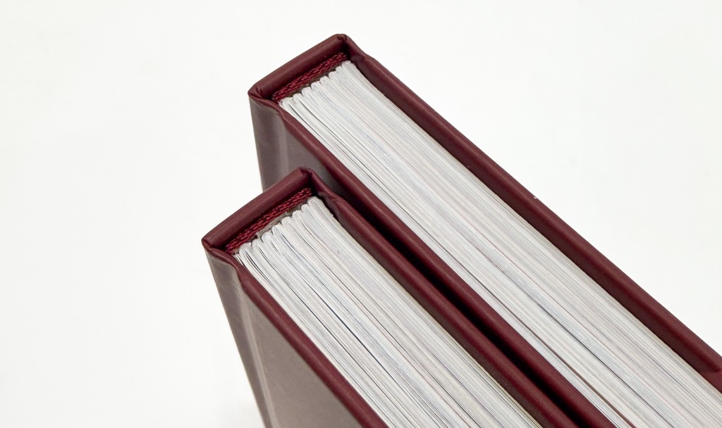 Image of two hardcover copies of  Too Polarising by Brodie Nalywajko from a birds eye view angle, printed by FolioFox