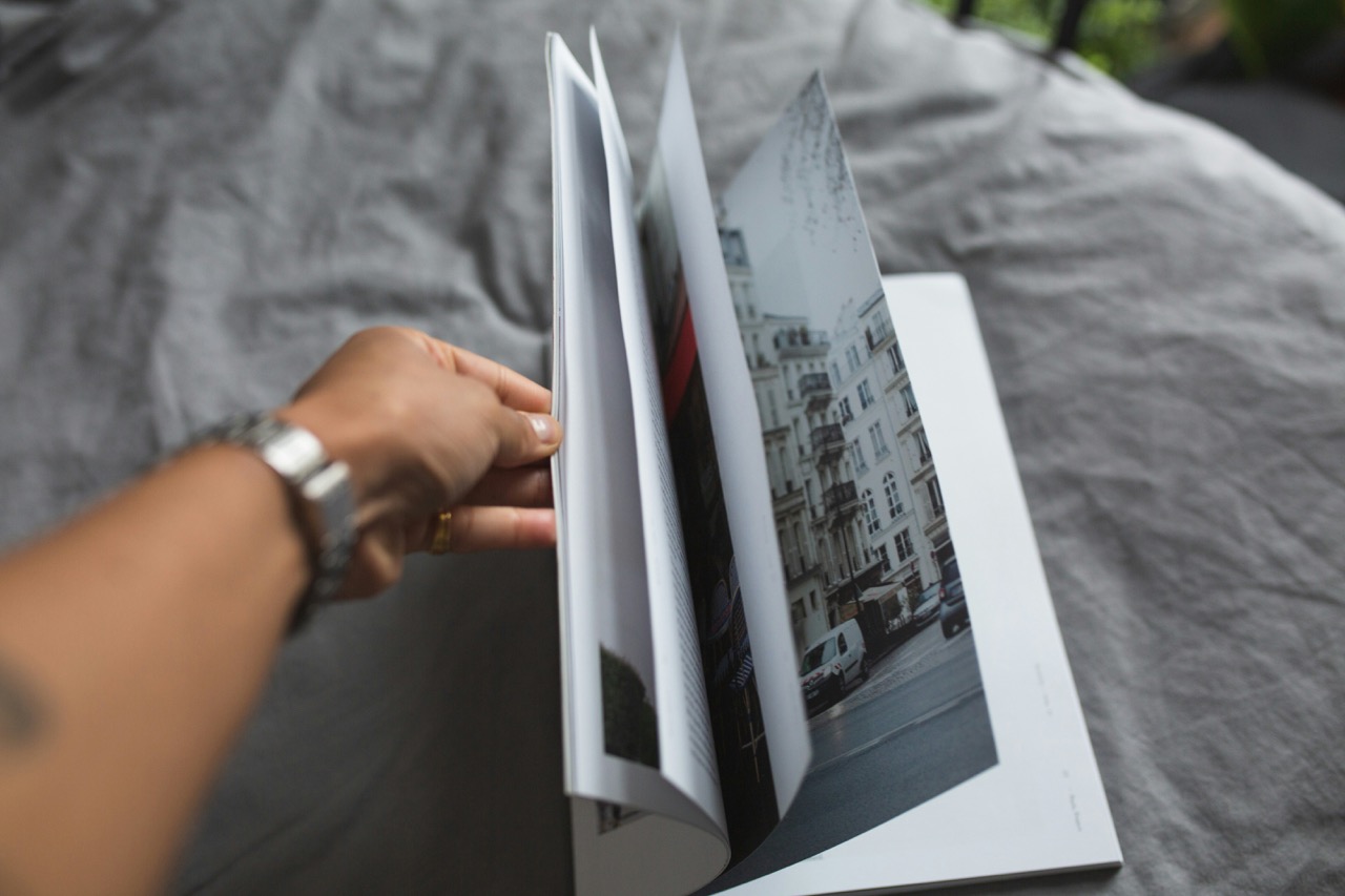 person flicking open the pages of a book. Source: Salomé Watel on Unsplash
