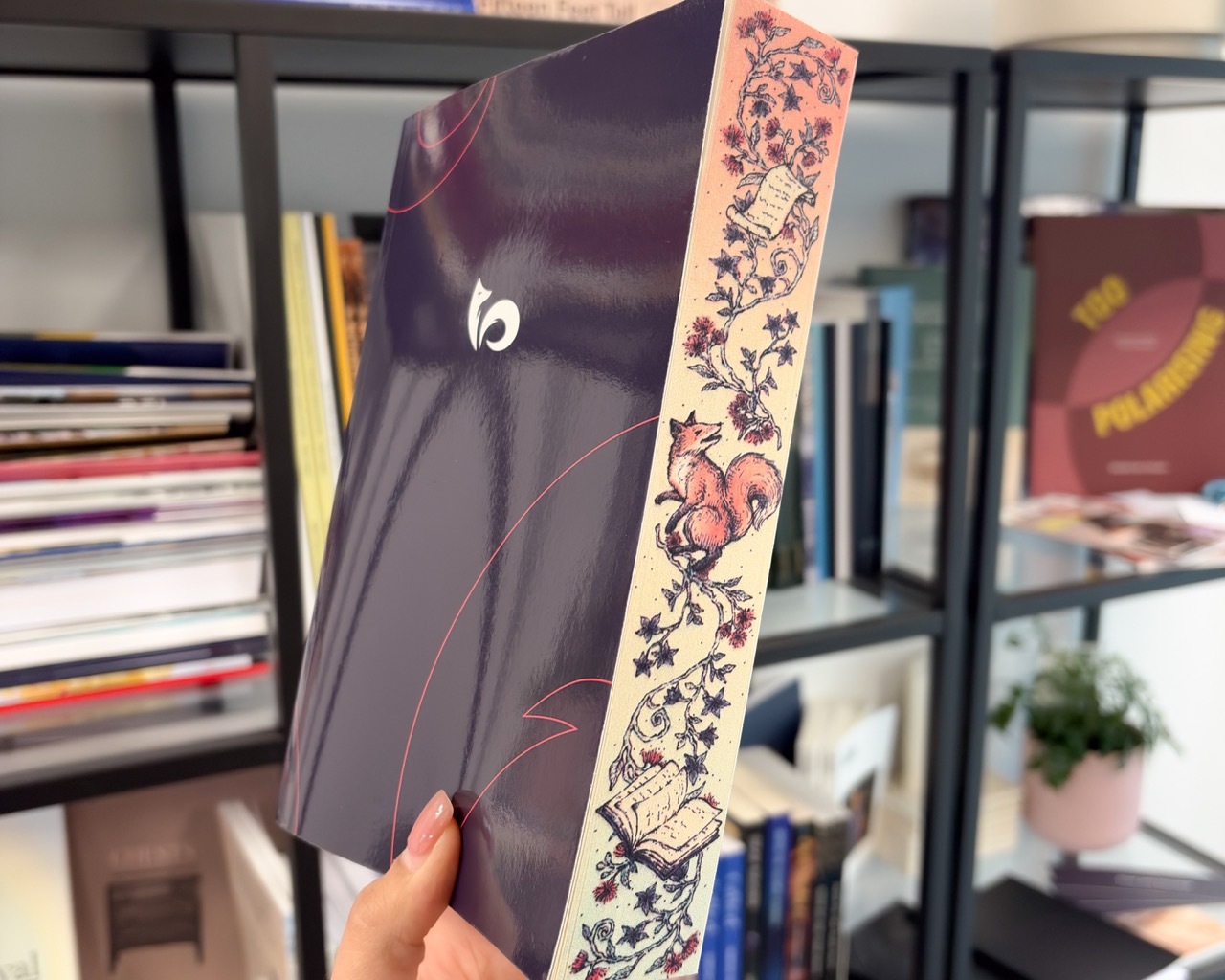 FolioFox's own branded paperback notebook, featuring illustrated sprayed edges