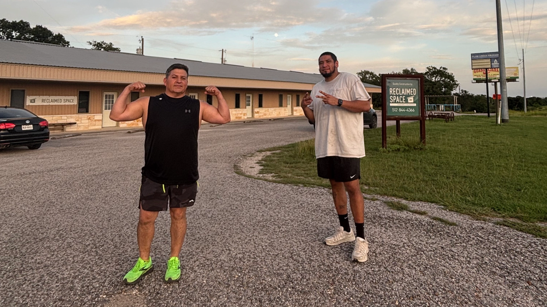 Two men standing in the middle of a road at On The Block Fitness in Lockhart, TX.