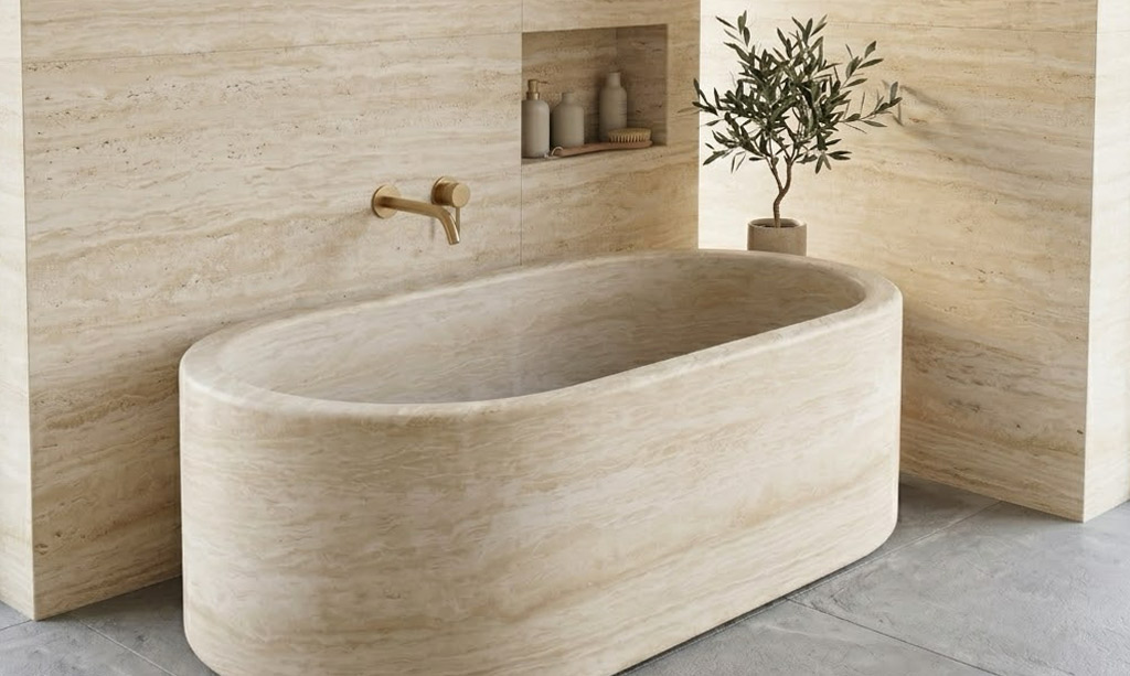 Freestanding bath set against a striking travertine natural stone feature wall.
