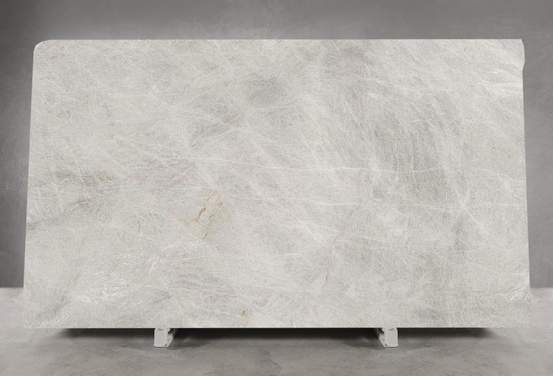 Large taj mahal quartzite slab resting outdoors, ready for fabrication into premium stone benchtops sydney