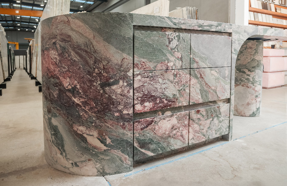 Curved waterfall end on a Six Senses Marble island, honed finish, sweeping stone return to floor, Marble Hub Sydney