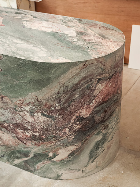 Curved waterfall end on a Six Senses Marble island, honed finish, sweeping stone return to floor, Marble Hub Sydney