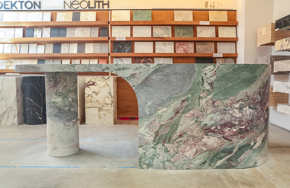 Vein flow carried continuously across stone-clad drawer fronts in Six Senses Marble, honed finish, Marble Hub Sydney