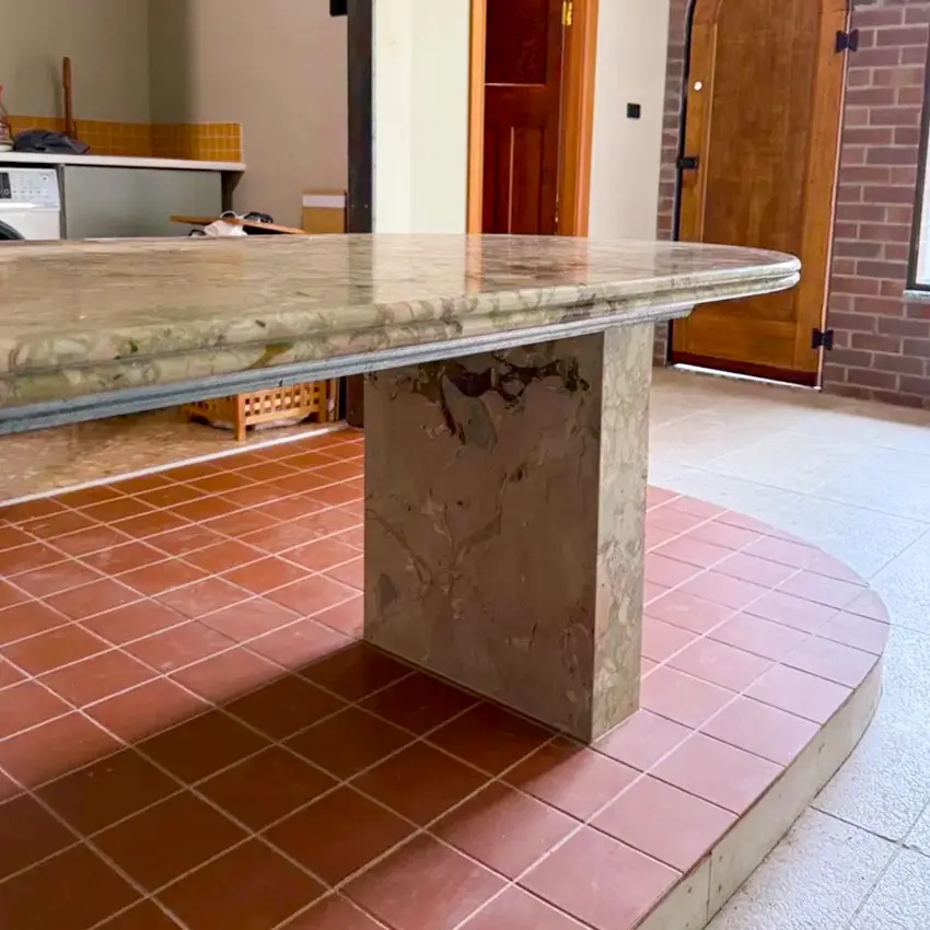Curved oval Breccia Rose Botticelli marble island with cantilevered overhang on twin stone plinths, cream, green and rose breccia movement, Sydney kitchen by Marble Hub