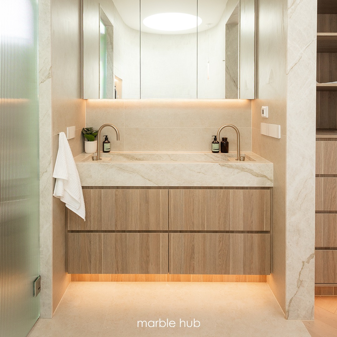 Taj Mahal Quartzite integrated stone trough vanity with timber joinery. Marble Hub install, Sydney.
