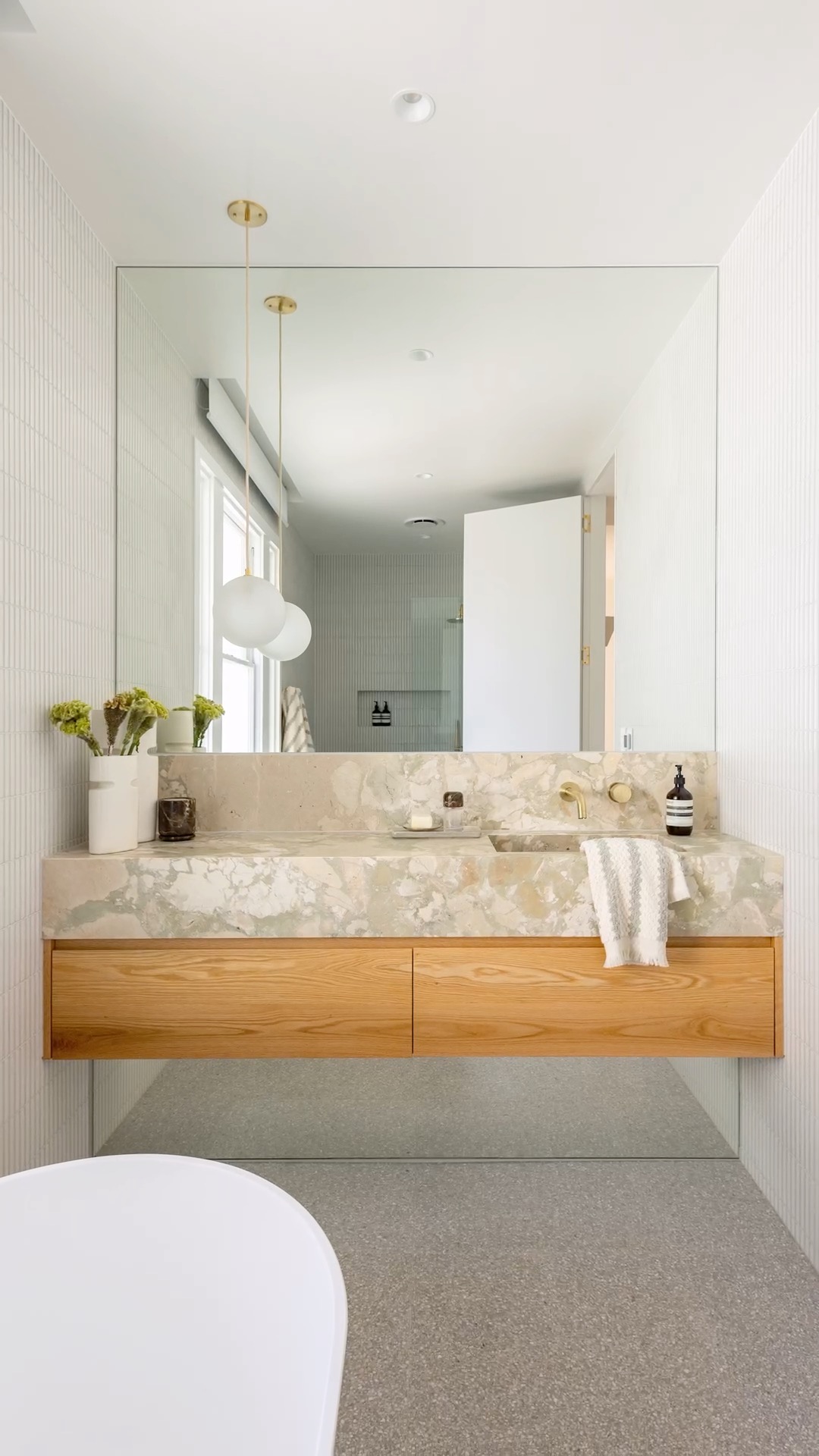 Breccia Rose Botticelli integrated basin with timber joinery and a stone splashback. Marble Hub install, Sydney.