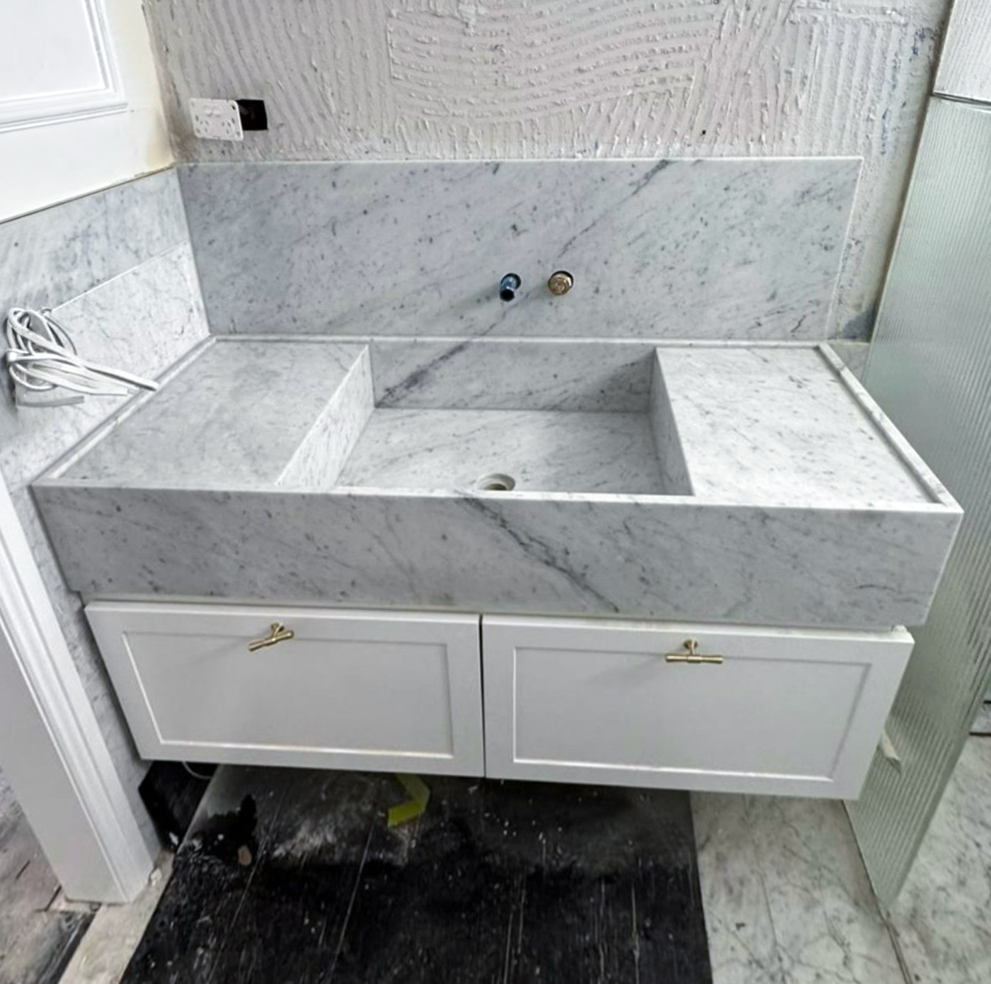 integrated trough with a matching stone splashback. Marble Hub install, Sydney.