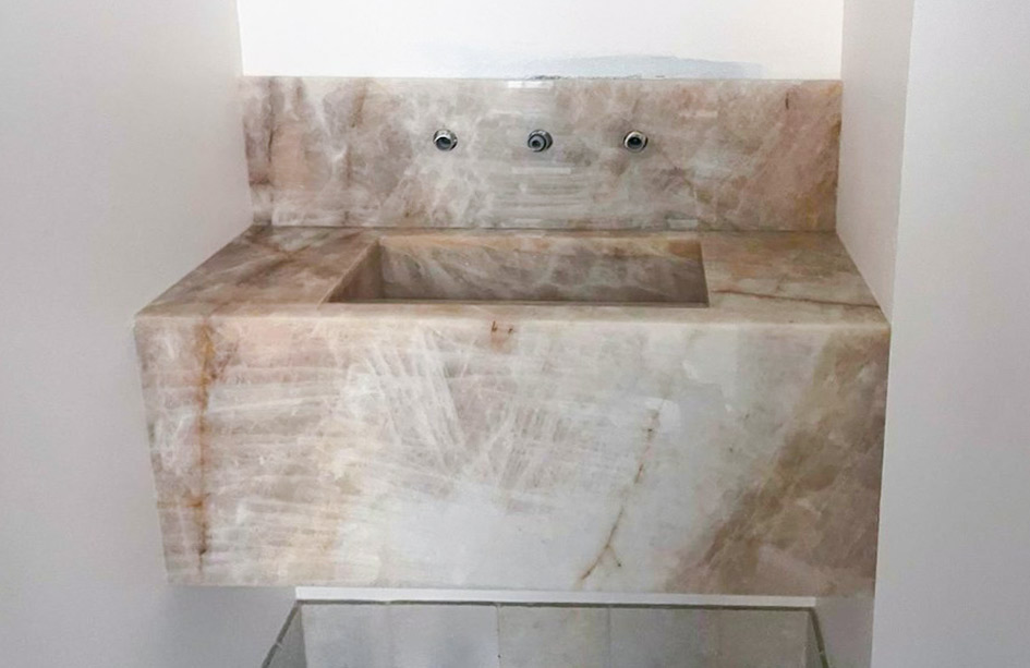 White Cristallo integrated basin in a powder room. Marble Hub install, Sydney.