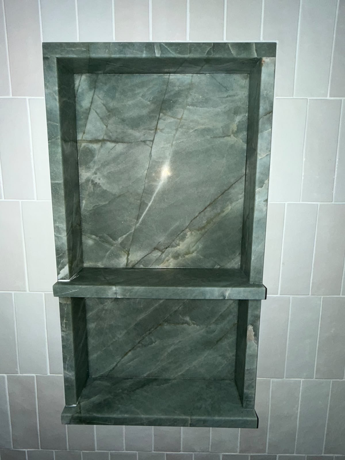 Esmeralda quartzite double shower niche in the same stone as the bath, white tile surround, Sydney bathroom.