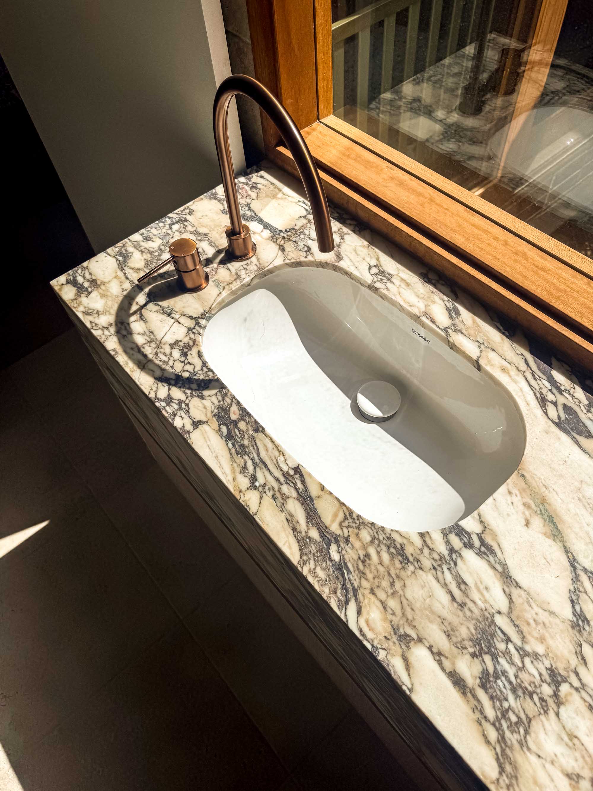 Calacatta Viola marble vanity, honed finish, undermount basin, bronze tapware, Sydney bathroom