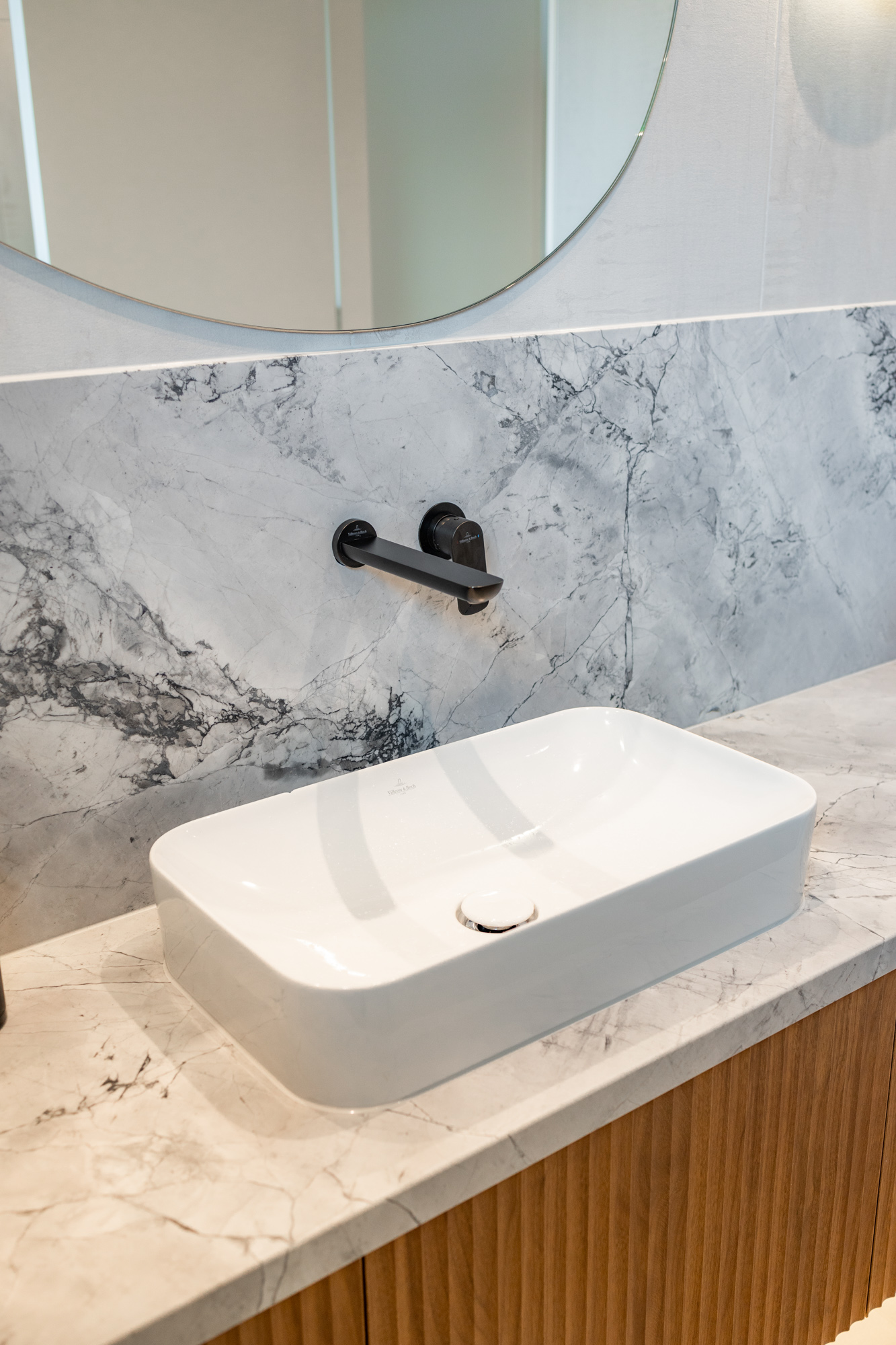 Super White quartzite vanity top with fluted oak joinery, above-counter basin, Sydney bathroom