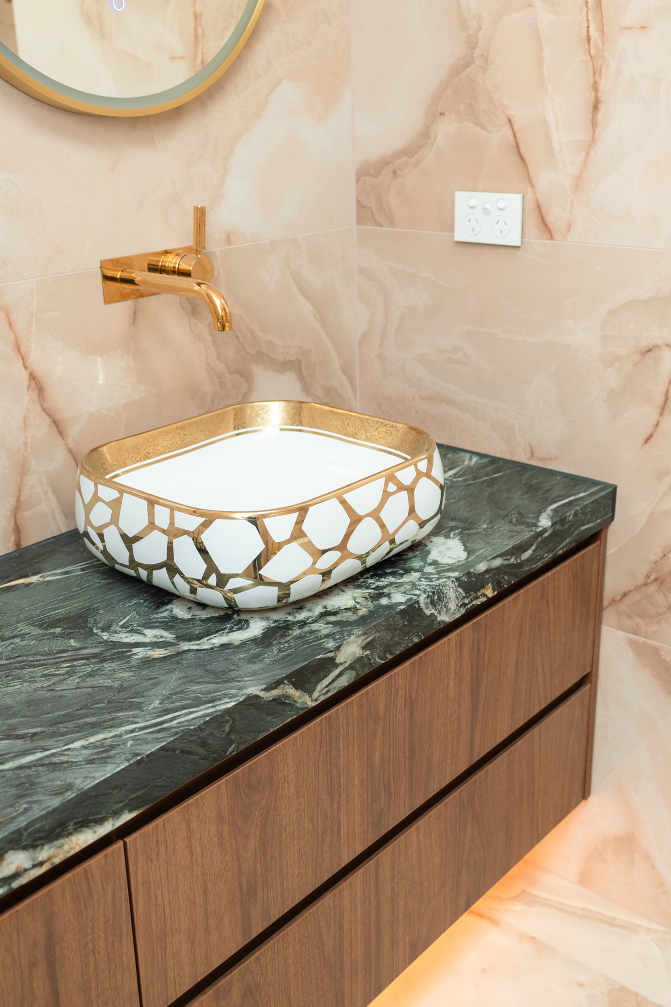 Deep green Arabescato Grigio Orobico marble vanity top, walnut joinery, gold basin, Sydney