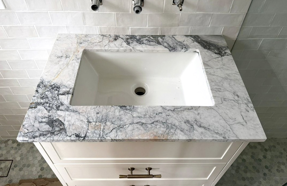 Calacatta Monet Extra marble vanity, mitred apron front, wall-mounted tapware, undermount basin, Sydney bathroom