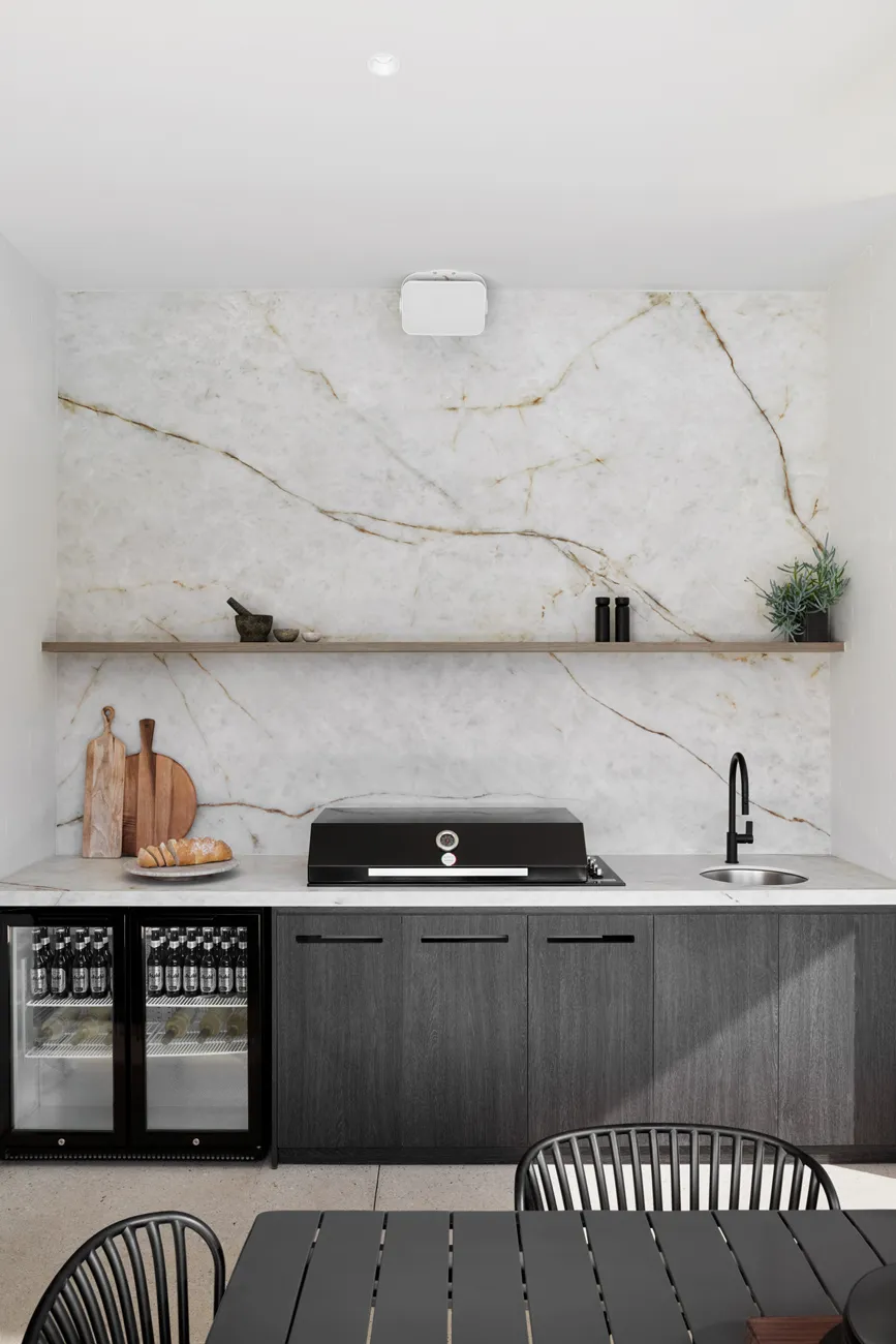 Neolith full-slab porcelain splashback in Silk matte finish behind a cooktop, large format, Sydney kitchen