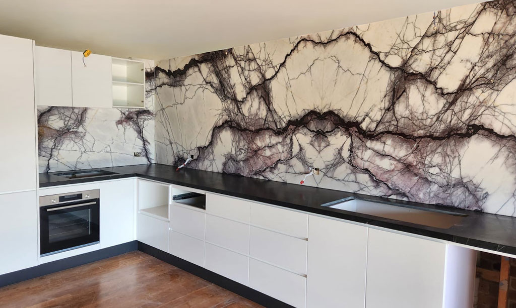 New york marble full slab splashback continuing benchtop veining up the wall, Sydney kitchen