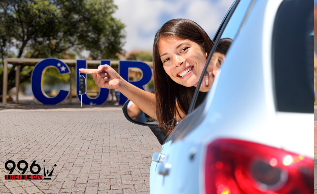 Female driver sticking head out of a rental car