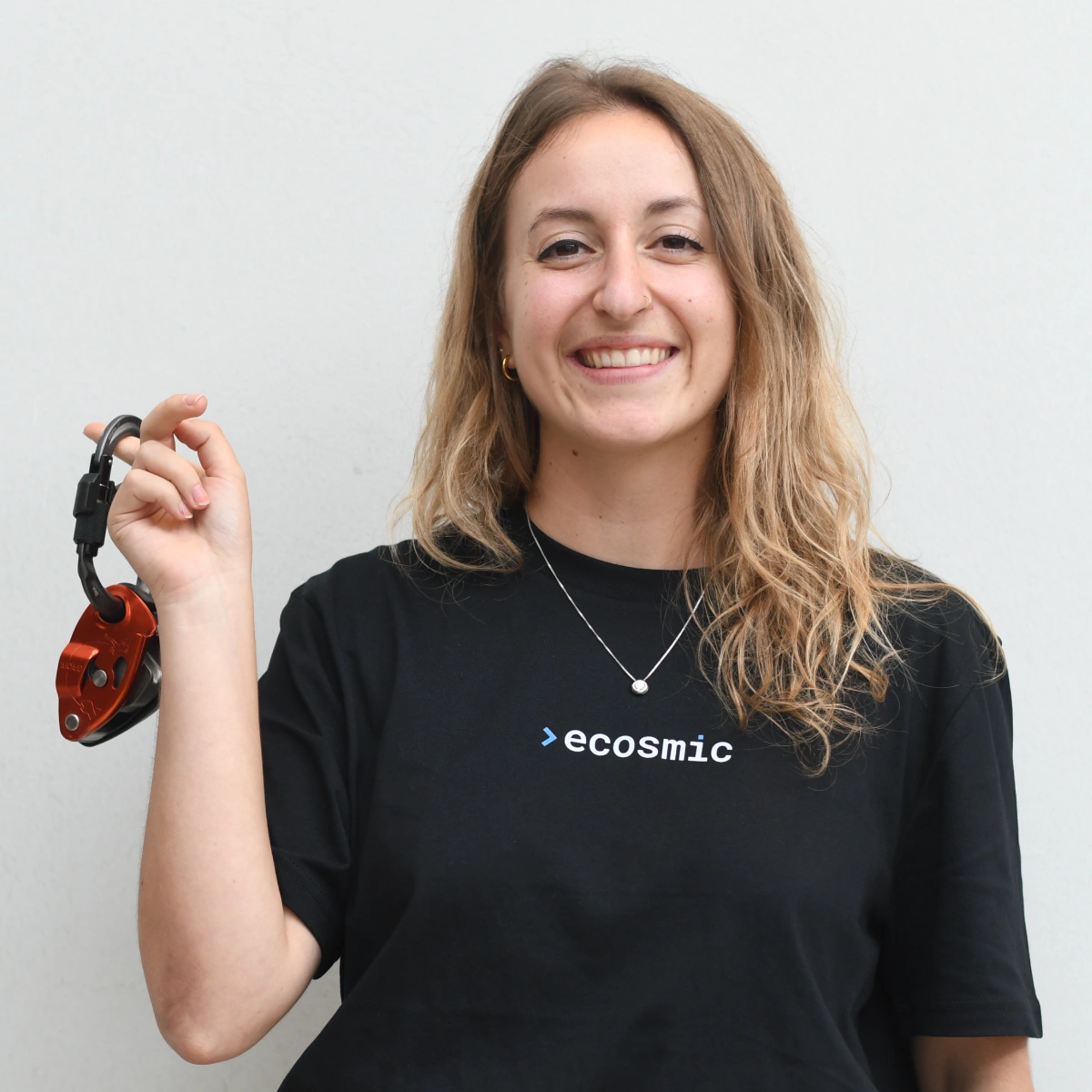 A professional headshot of Benedetta doing a fun pose