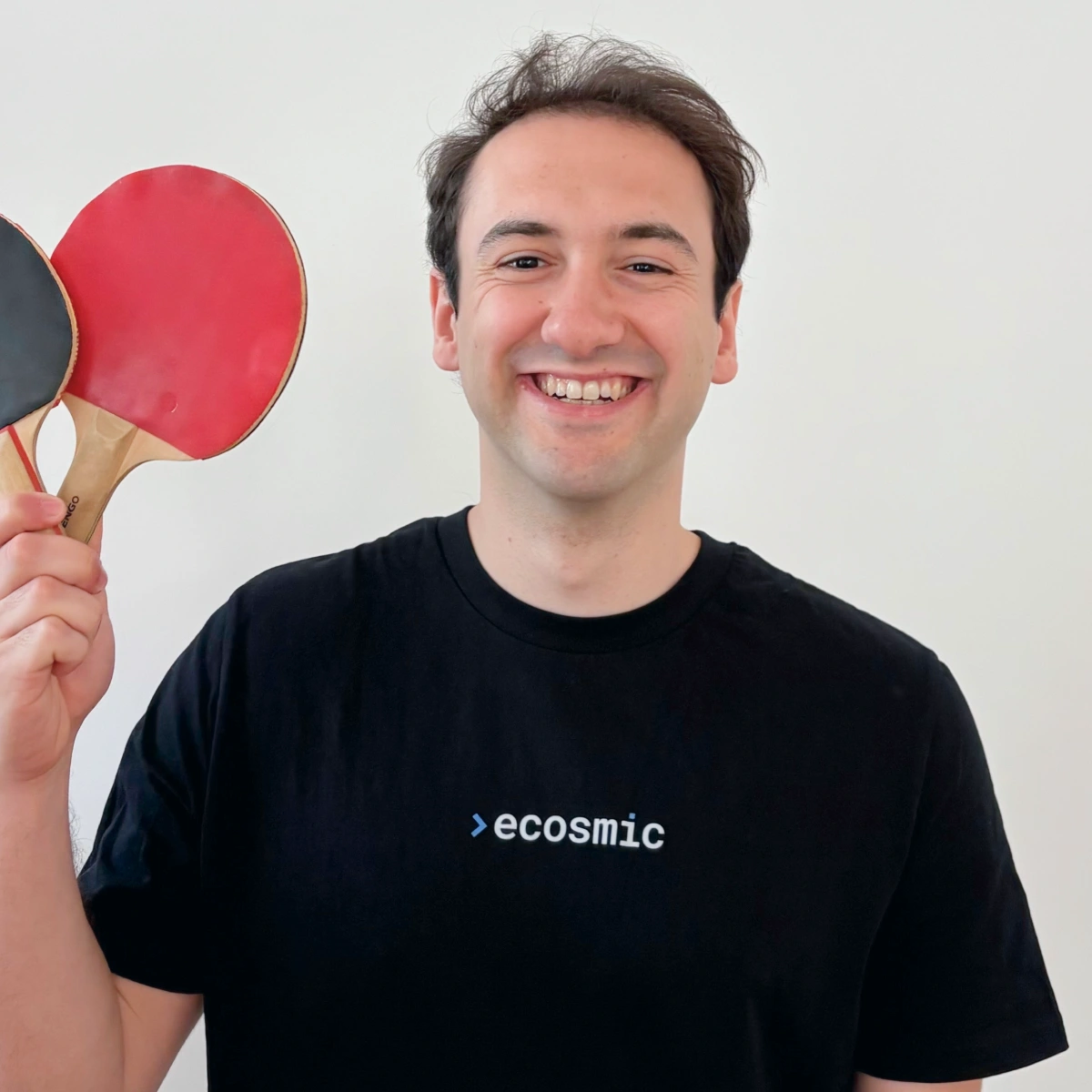 A professional headshot of Ruggero doing a fun pose