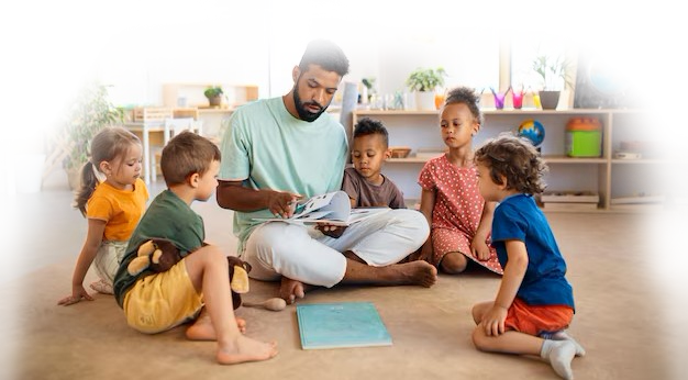 group-small-nursery-school-children-with-man-teacher-sitting-floor-indoors_1074916-13041