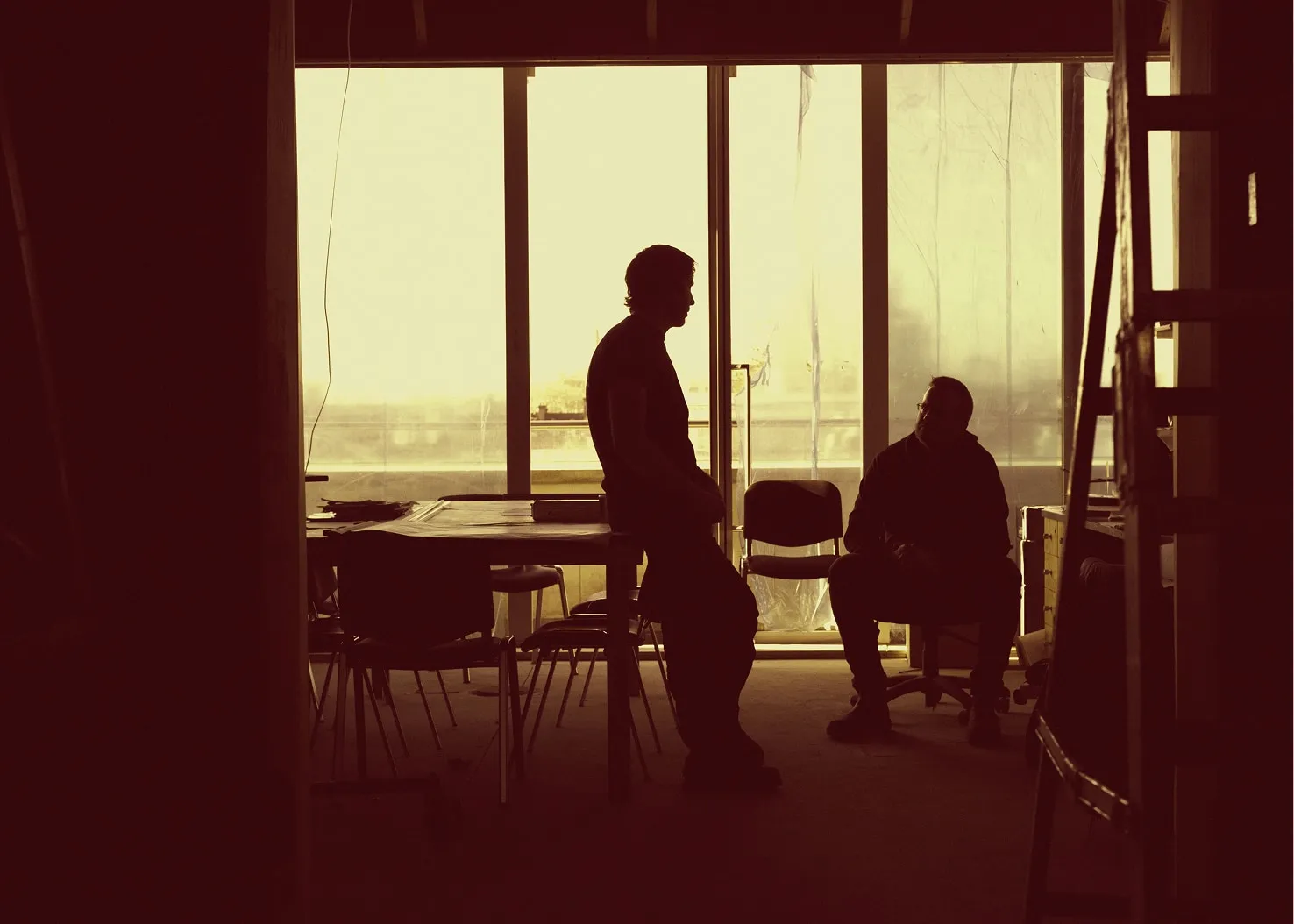 Two LDB construction workers talking in a building site