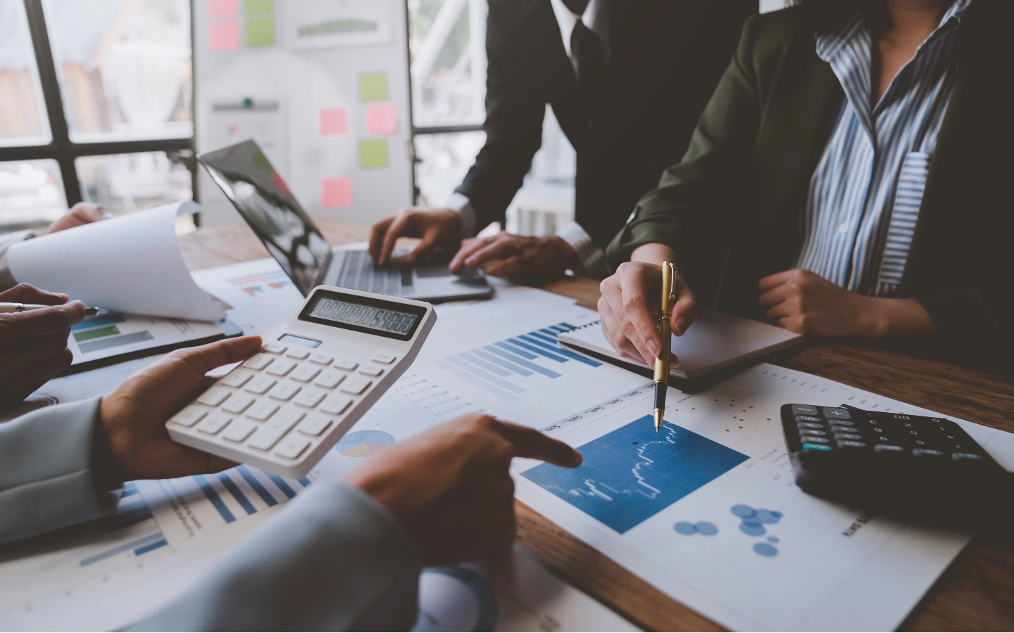 Accountants reviewing reporting to identify trends