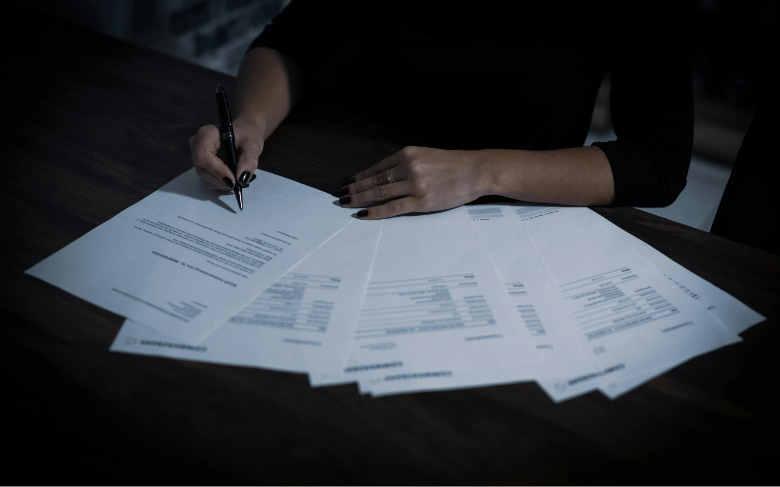 Image of woman signing leases