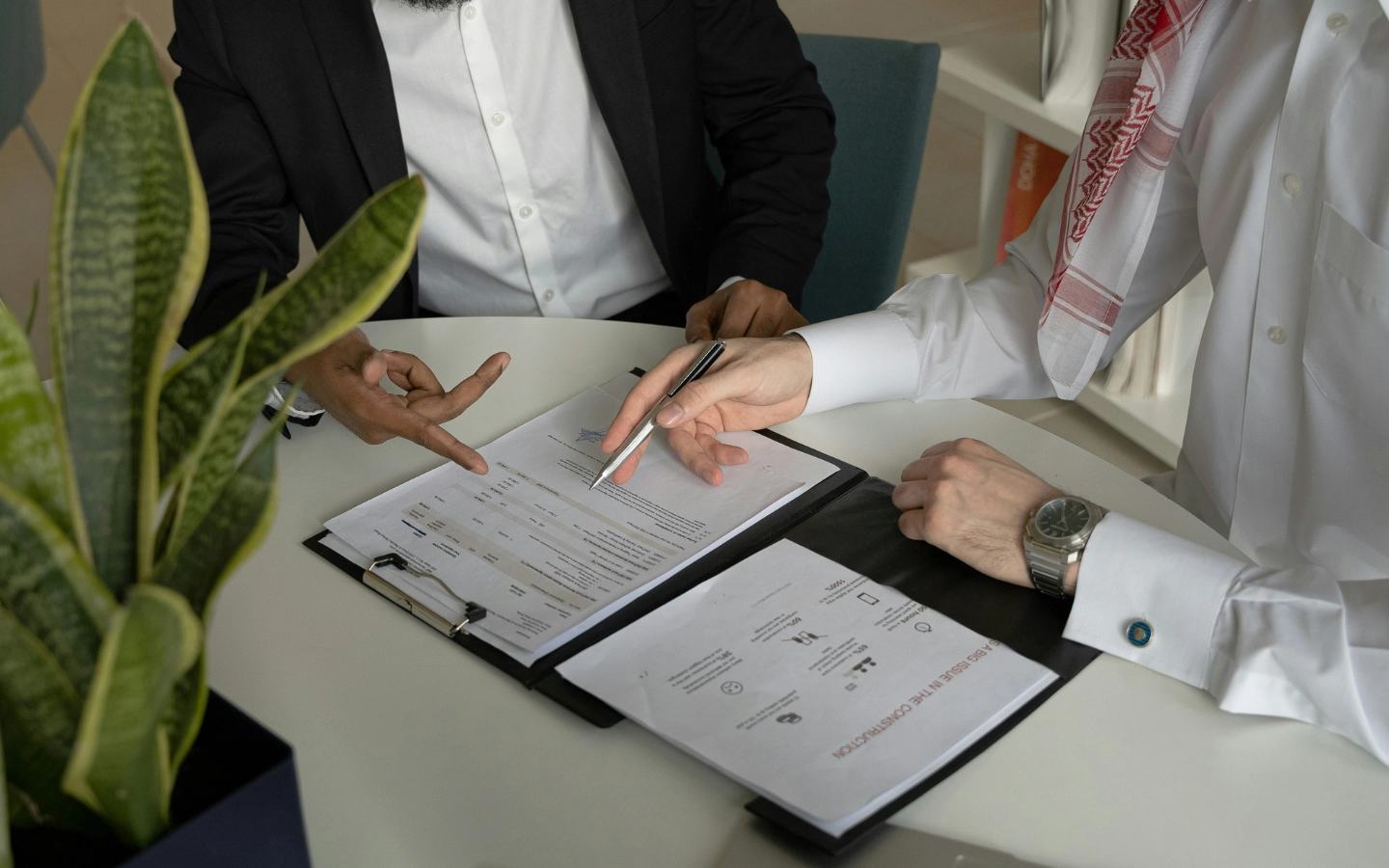 Image of person signing contract