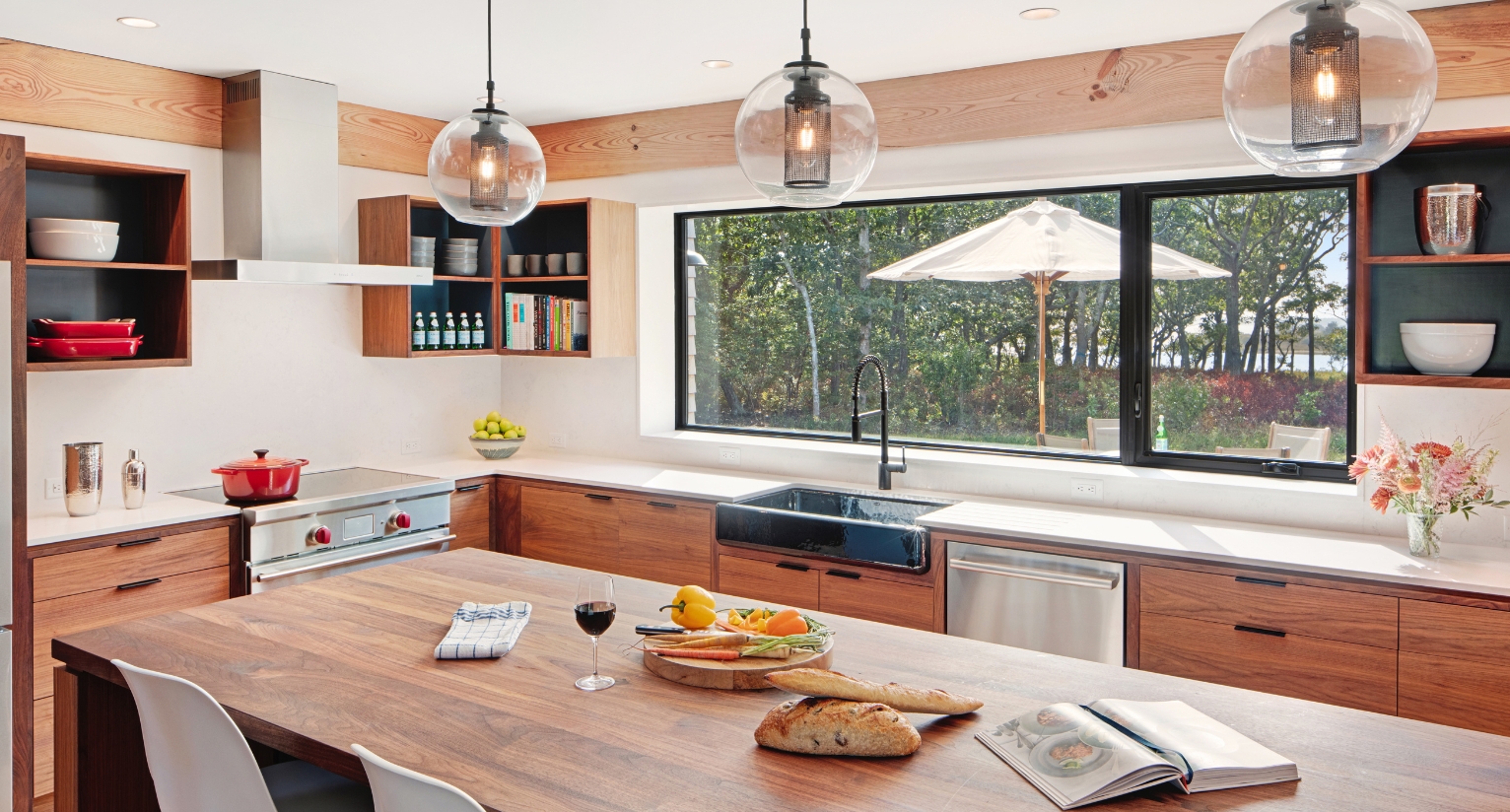 Spacious contemporary kitchen with bar overlooking the pool