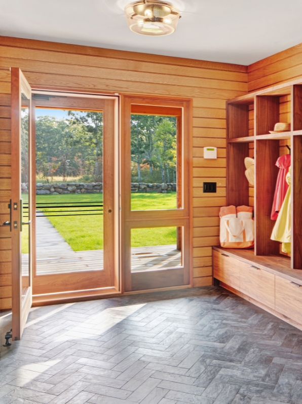 Spacious wood-panelled mudroom.