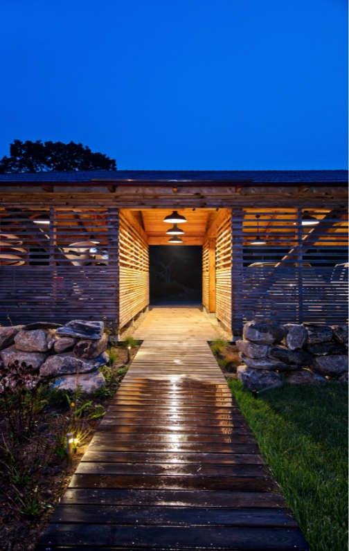 Well lit carport at dusk.
