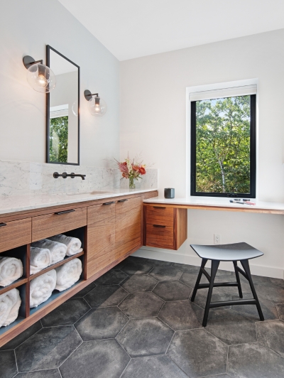 Simple but luxurious bathroom vanity with window.