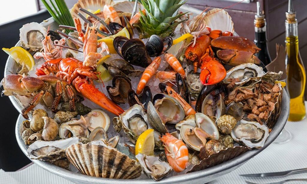 Refined seafood platter with lobster, oysters, crabs, shrimps and shellfish served at the Locquirec hotel, ideal for gourmets.