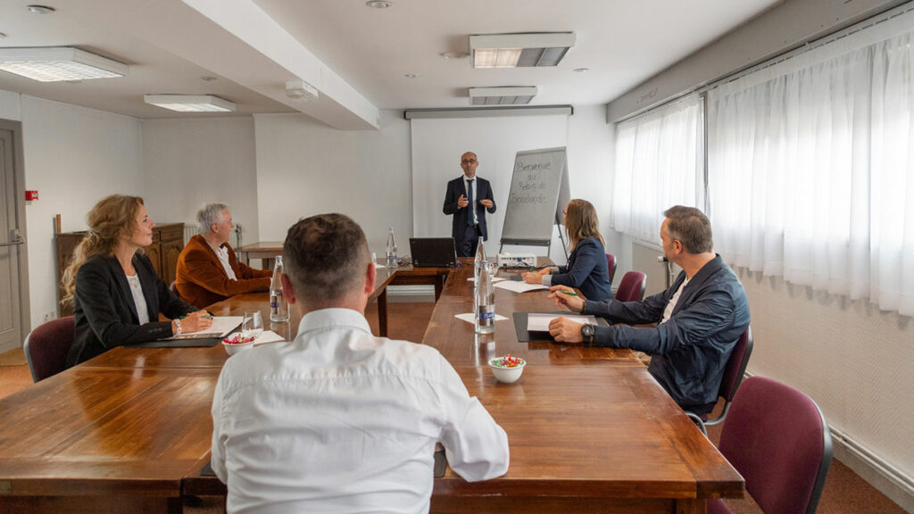 Business meetings in a seminar room at the Relais de Brocéliande hotel in Paimpont.