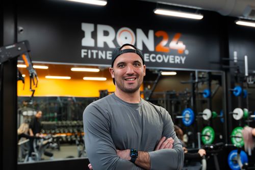 A picture of Sam Pitcairn, head personal trainer, smiling at the camera