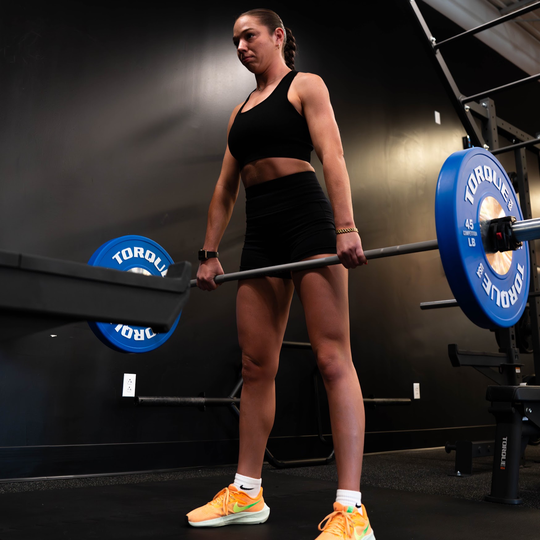 Coach correcting a client's lifting posture at Essential Strength Pittsburgh