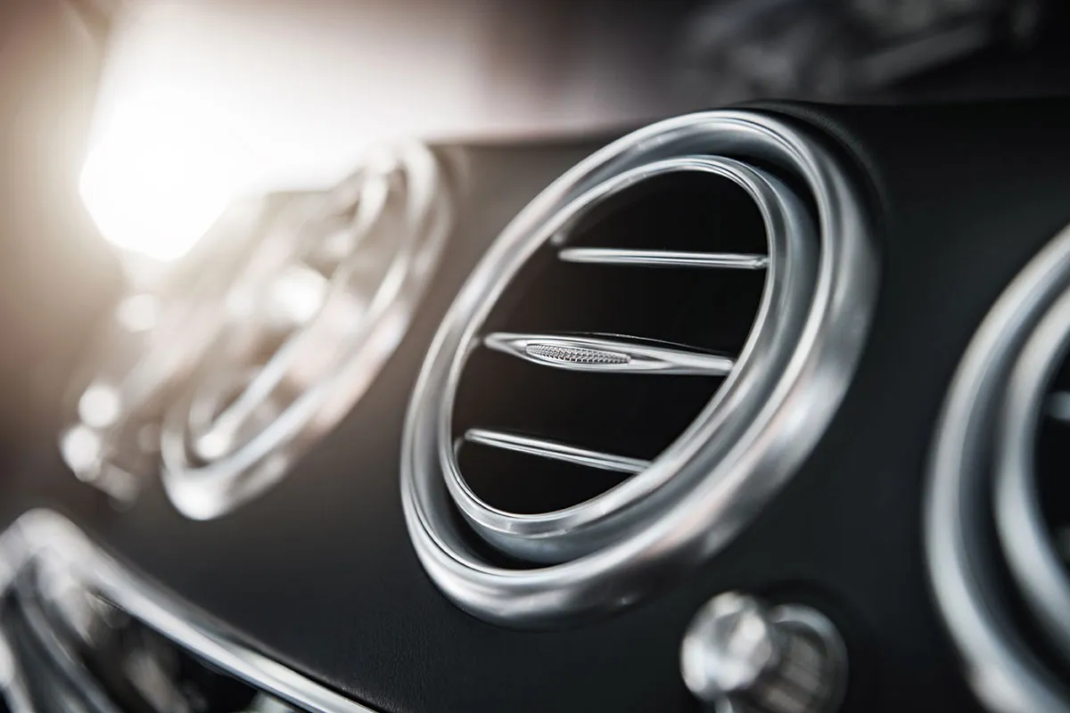 The interior of a car with the fans close-up.