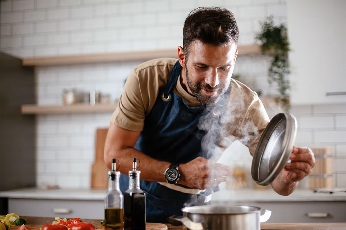A person cooking in their kitchen.