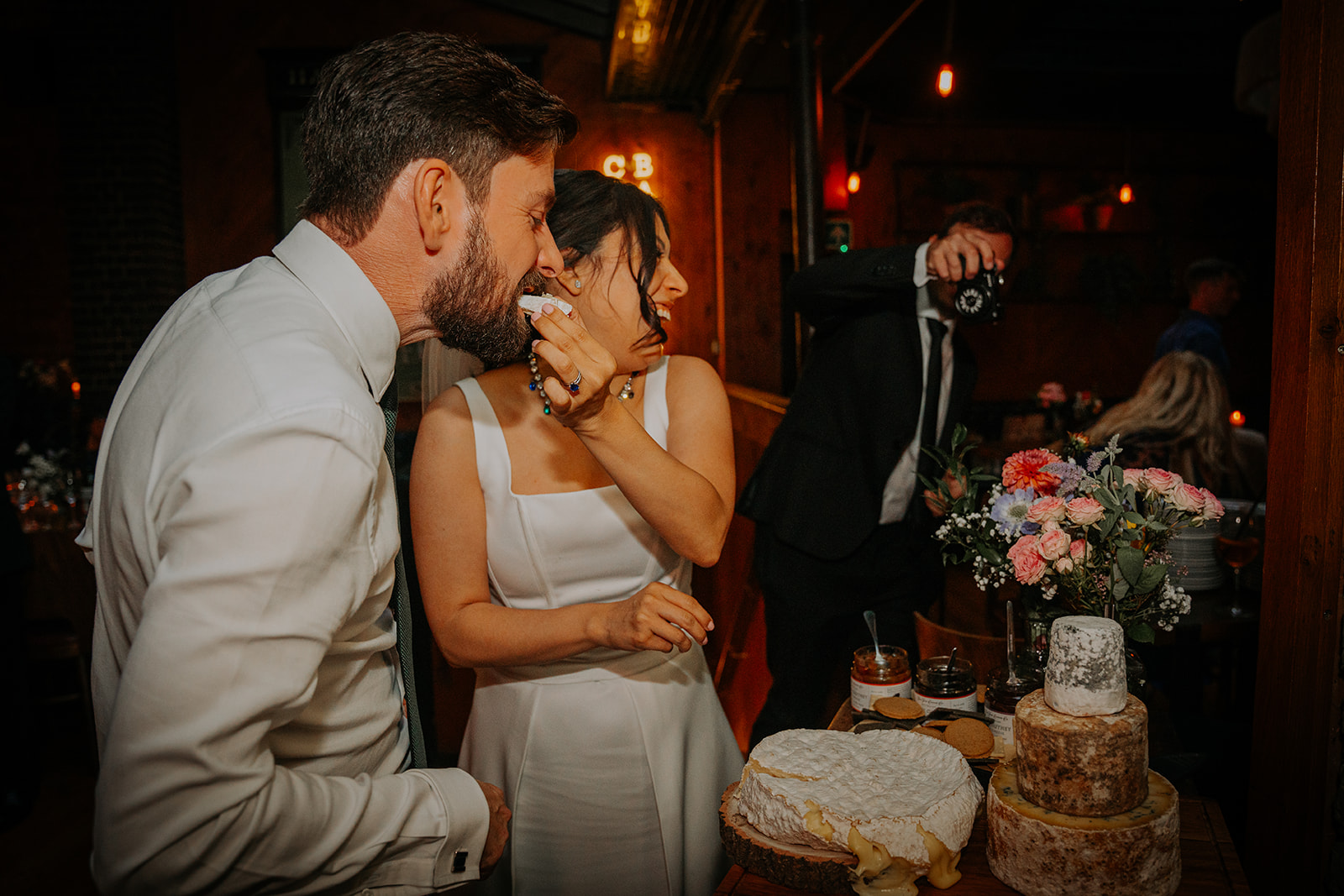 Couple celebrating their wedding at Harrild & Sons pub wedding venue in Farringdon, featuring an atmospheric urban pub setting.